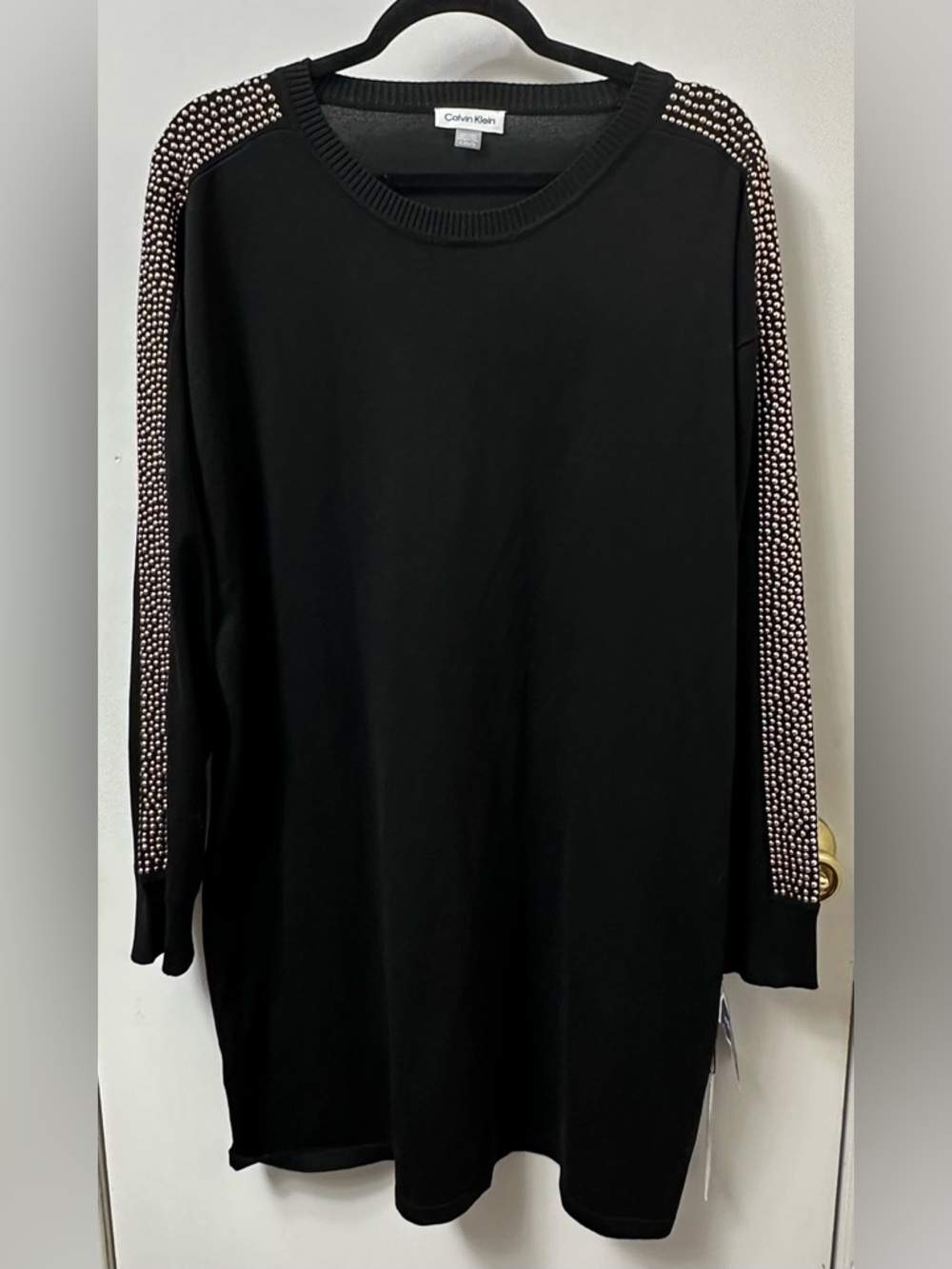 Calvin Klein Black gold down the arms 
smoke free home.